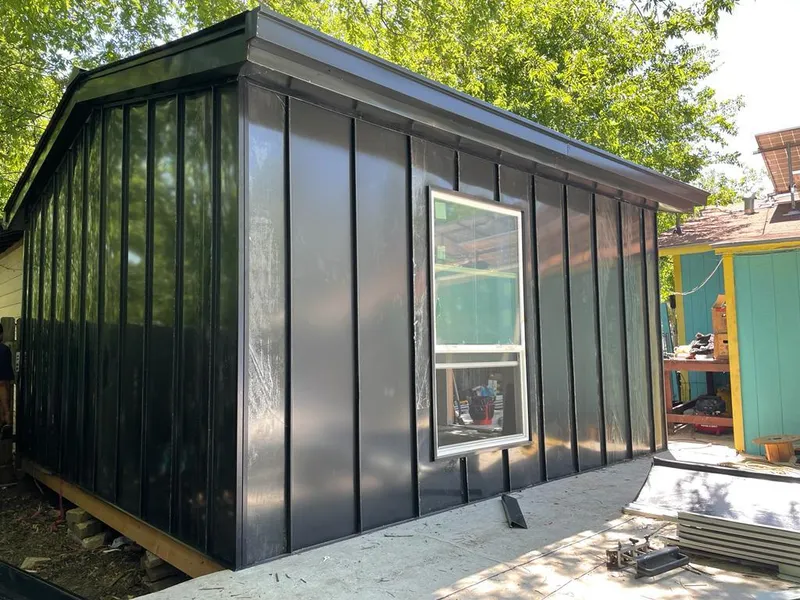 Black standing seam metal wall panels for Roof Inspection in Highwood