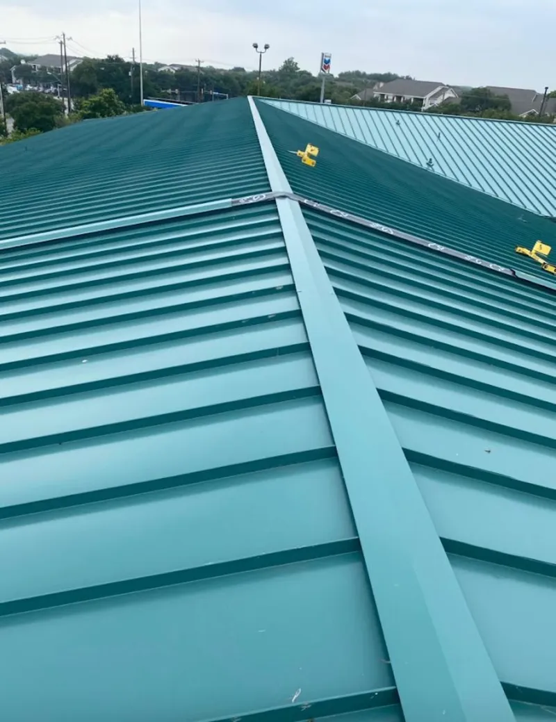 Green commercial metal roof ridge and valley for Metal Roof Repair in Highwood
